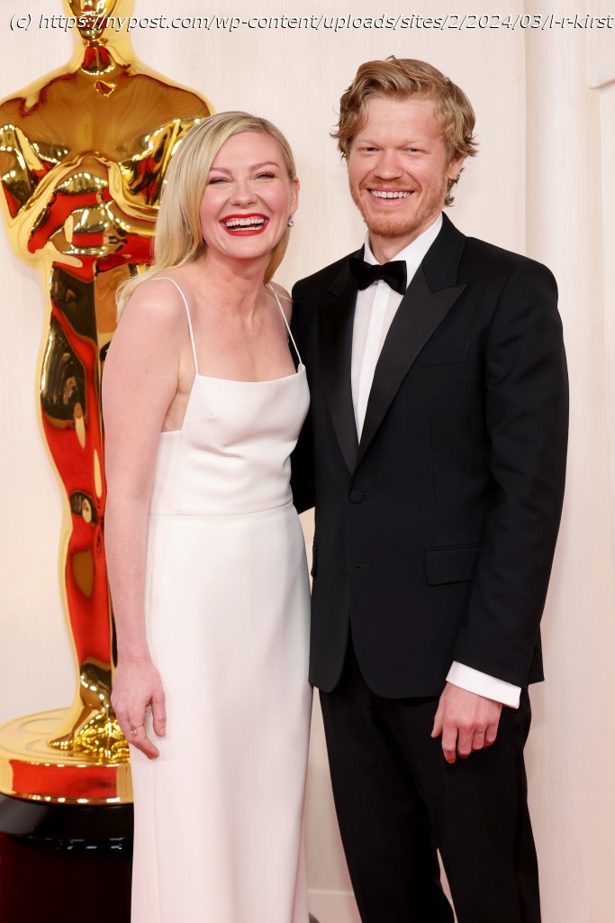 Kirsten Dunst trips and nearly crashes into Oscars 2024 statue on red